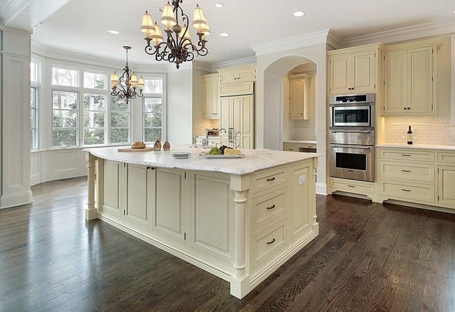 close-up of hand scraping laminate floors in Forest View